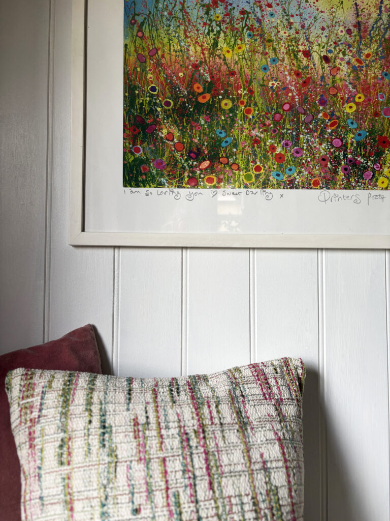 Colourful artwork, panelling, cushions
